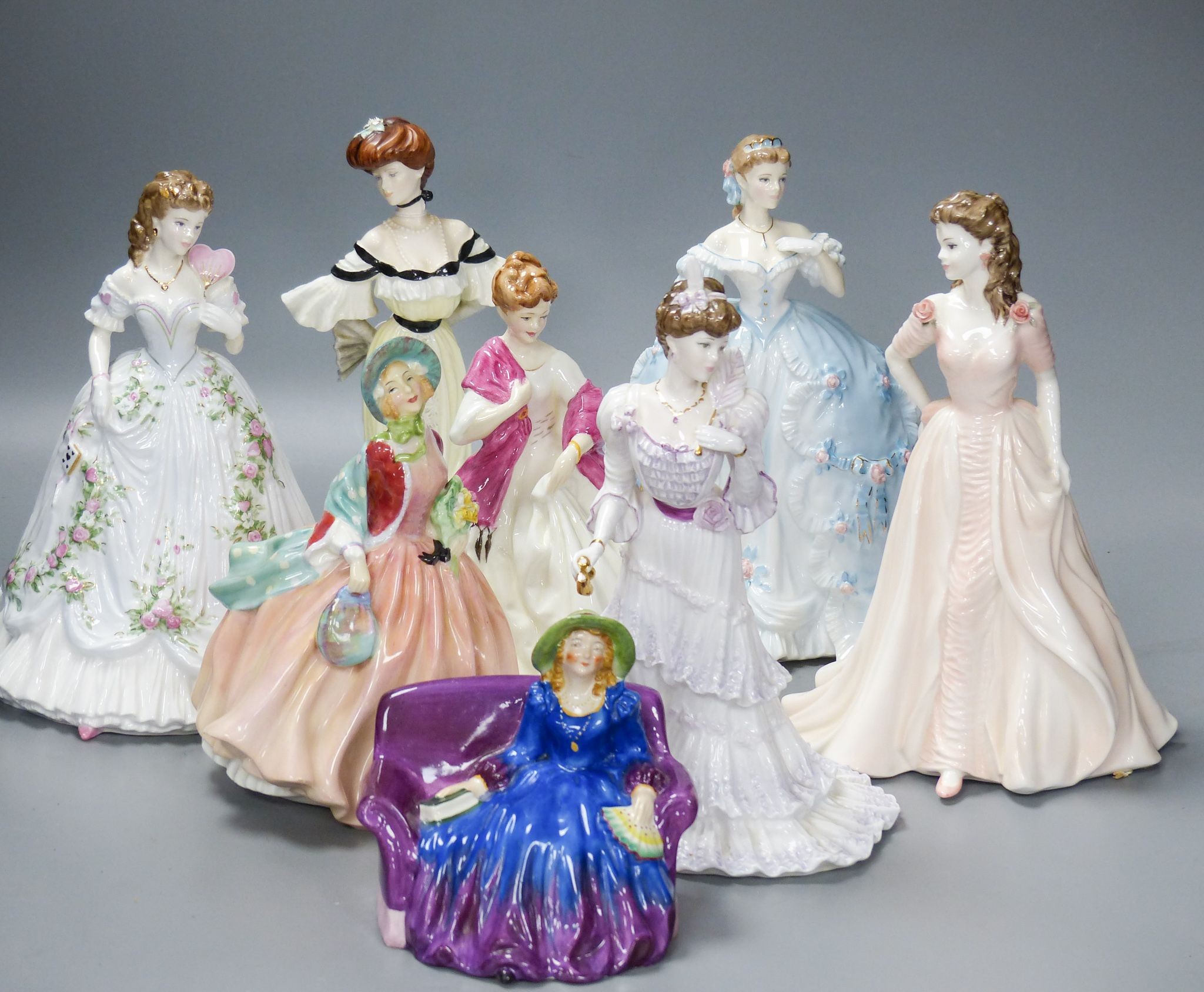 Seven Worcester, Coalport and Doulton ceramic lady figures